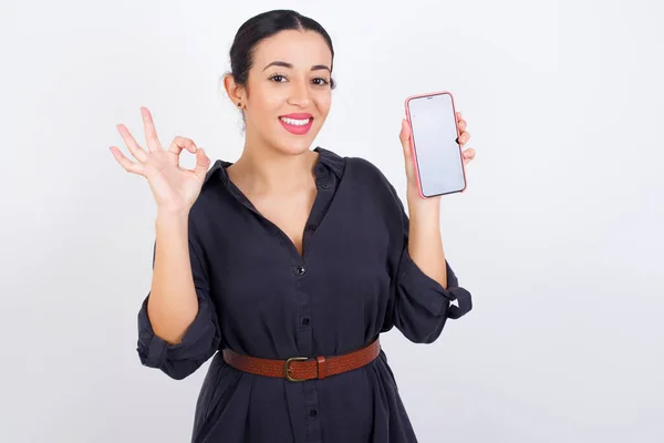 Excited Businesswoman Wearing Dress Showing Smartphone Blank Screen Blinking Eye — Stock Photo, Image