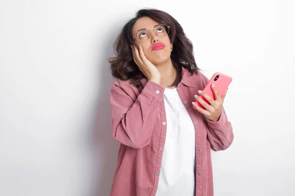 Brunette Arab Woman Wearing Pink Shirt Keeps Hands Cheeks Has — Stock Photo, Image