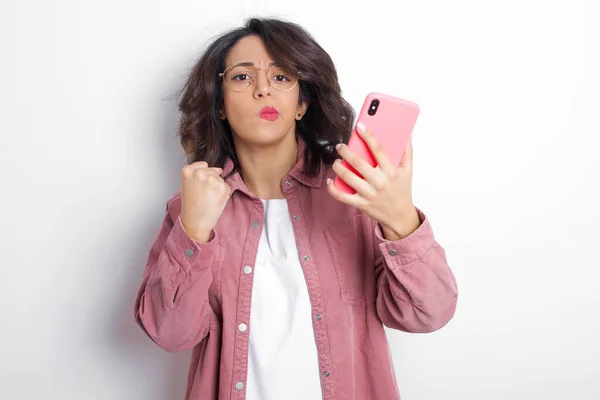 Displeased Annoyed Young Latin Woman Wearing Pink Shirt Clenches Fist — Stock Photo, Image