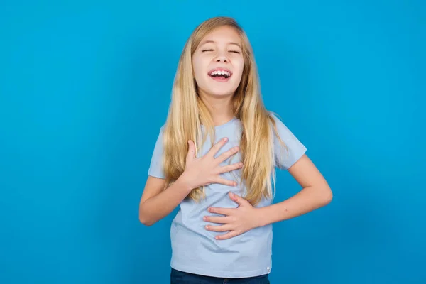 Beautiful Caucasian Girl Wearing Blue Shirt Keeps Hands Crossed Laughs — Stock Photo, Image