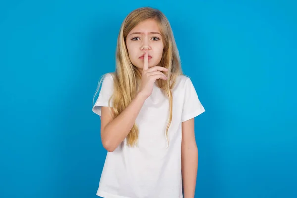 Beautiful Caucasian Girl Wearing Shirt Makes Silence Gesture Keeps Index — Stock Photo, Image