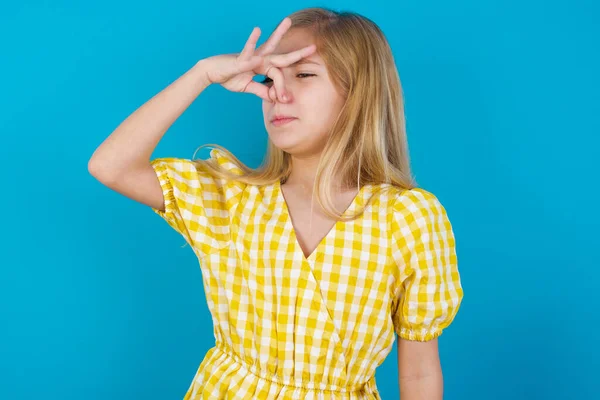 Displeased Beautiful Caucasian Girl Wearing Dress Plugs Nose Smells Something — Stock Photo, Image