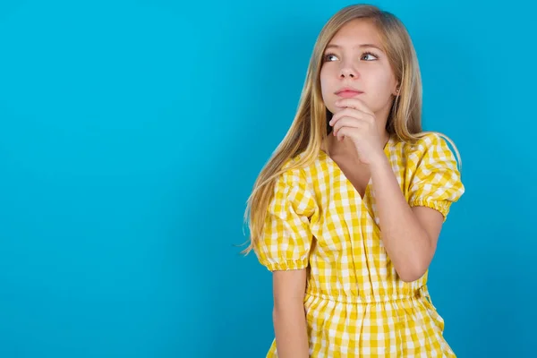 Thoughtful Beautiful Caucasian Girl Wearing Dress Holds Chin Looks Away — Stock Photo, Image