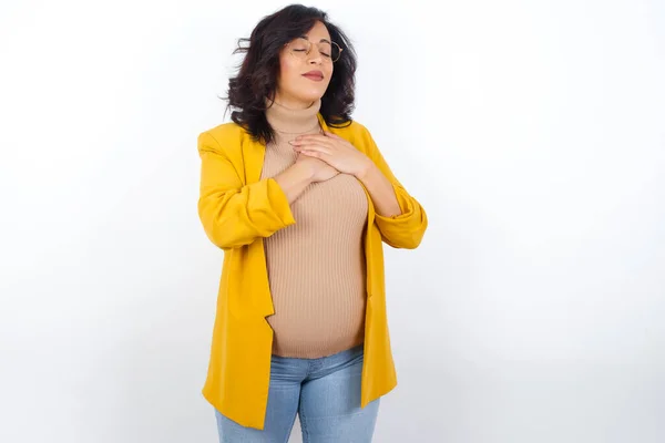 Pregnant Woman Closes Eyes Keeps Hands Chest Heart Expresses Sincere — Stock Photo, Image