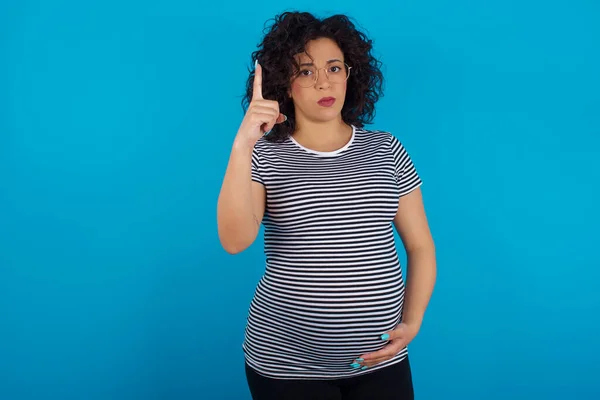 pregnant woman  frustrated and pointing to the front