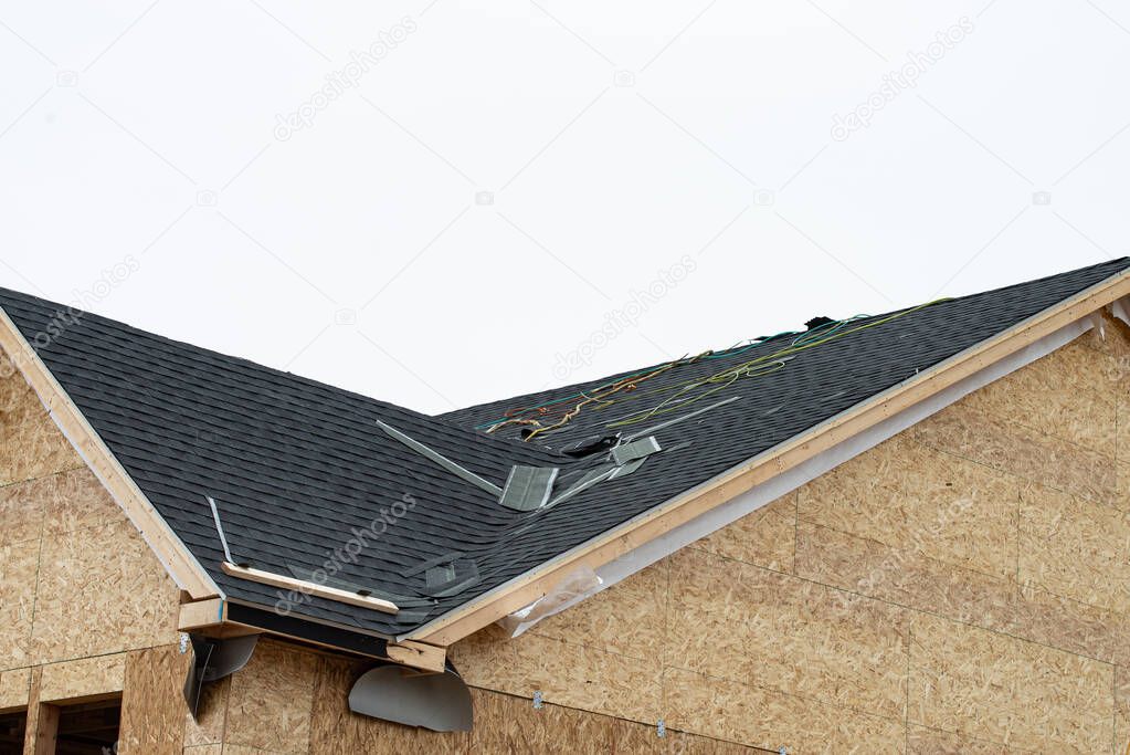 the roof of a plywood house building under