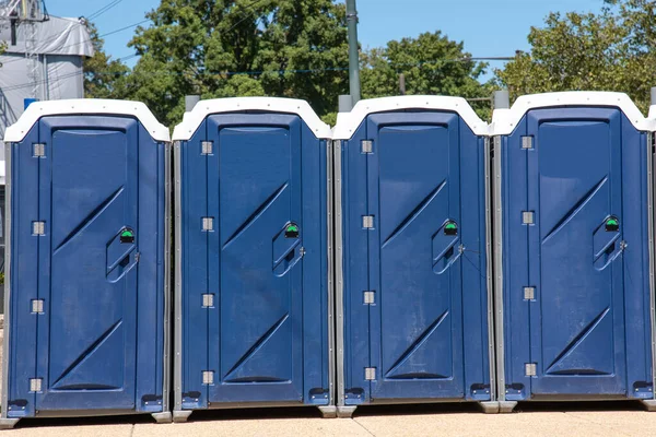 Public toilets on road blue plastic modern Stock Photo
