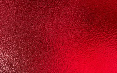 Kırmızı parlak folyo metalik kağıt doku arka planı. Noel ve Sevgililer Günü konsepti için kullan.