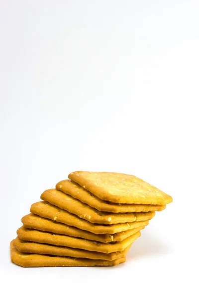 Biscoito com sementes de gergelim branco sobre fundo branco — Fotografia de Stock