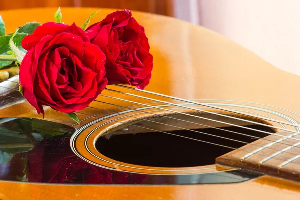 Guitar and rose Royalty Free Stock Images