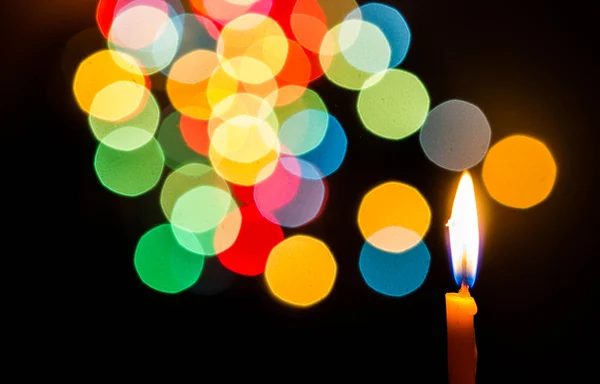 Candle light at night with color bokeh — Stock Photo, Image