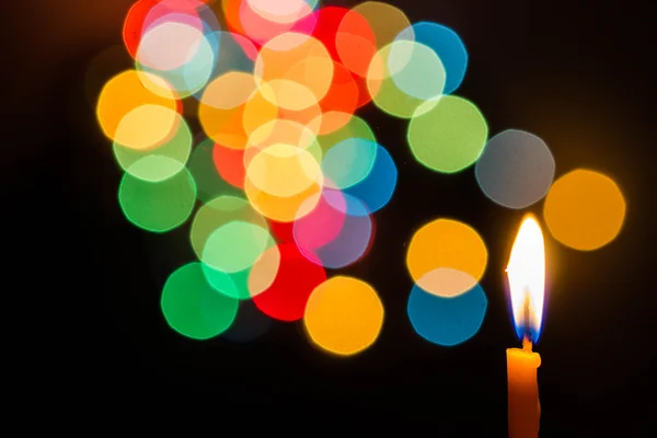 Candle light at night with color bokeh — Stock Photo, Image