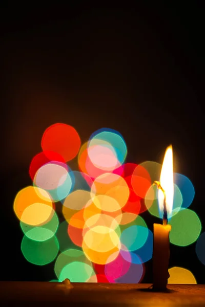 Candle light at night with color bokeh — Stock Photo, Image