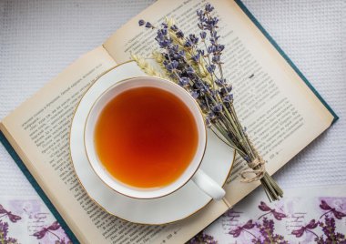 Lavender and a cup of tea on a book