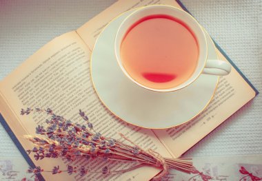 Lavender and a cup of tea on a book