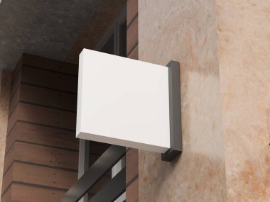 Bej taştan alışveriş merkezi duvarında boş logo modeli asılı.