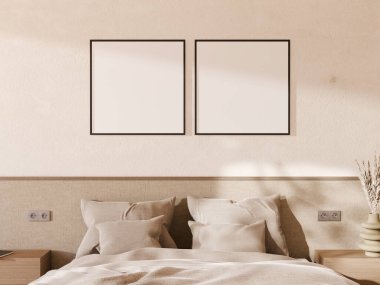 Duvarında şık, temiz bir çerçeve olan açık renkli bir yatak odası..