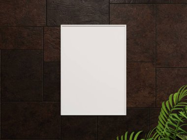 Köşesinde yapraklı bir bitki olan siyah taş bir duvarda beyaz bir çerçeve..