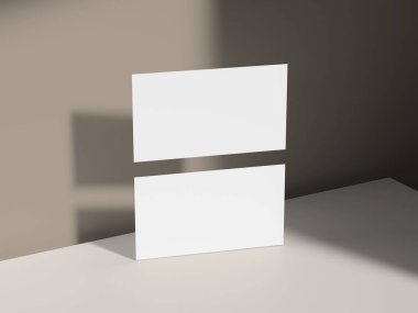 Zarif ışık ve nötr stüdyo sahnesiyle yüzen kartvizit modeli.