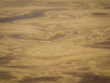 Organik tahıl ve sıcak tonlardan oluşan ahşap dokular.