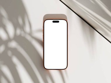 Beyaz ekran ve beyaz yüzey üzerinde palmiye yaprağı gölgesi olan üst görünüm akıllı telefon modeli