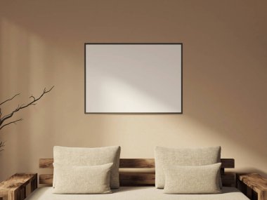 Yatay siyah çerçeve bej bir duvarda, rahat bir yatak odası ayarında.