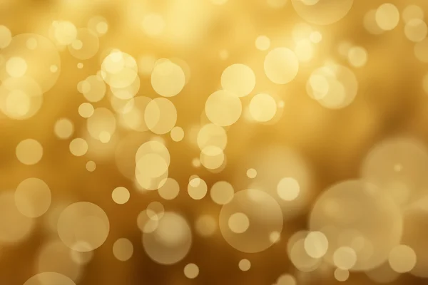 Onscherpe Golden Bokeh achtergrond met sparkles en glitter. Gouden — Stockfoto