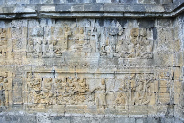 Lugar religioso Dintel de pared decorativo Asia Patrimonio cultural Bajorrelieve de piedra en la pared de Borobudur, Java, Indonesia — Foto de Stock