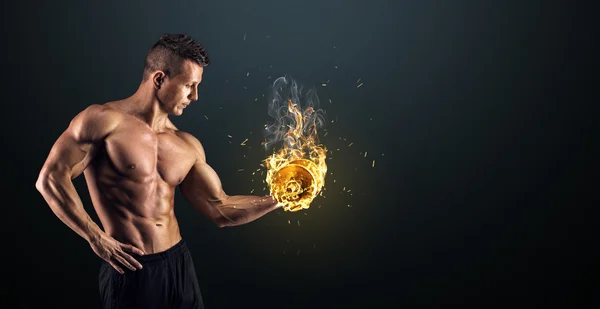 Muscular man with dumbbells on black background