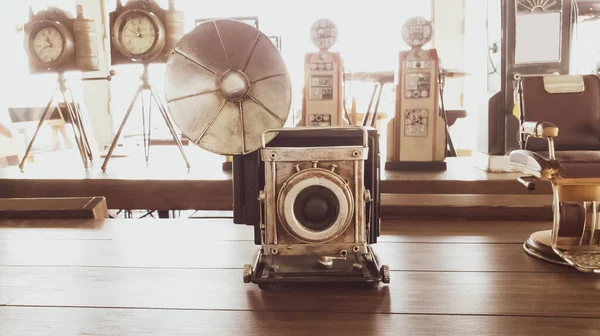 Retro classic film  camera  old object art  on wood table vintage tone