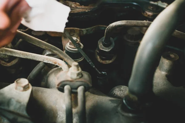 Hand Mechanic Repairing Car Checking Level Oil Vintage Tone Selective — Stock Photo, Image