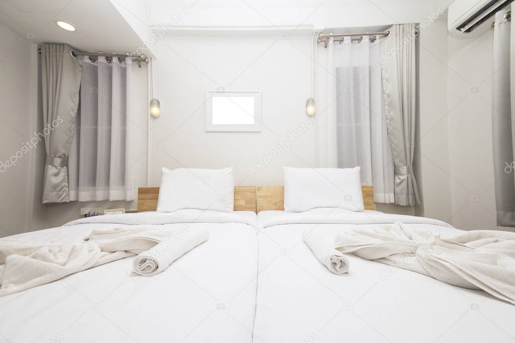 Clean white bedroom, nice view, guesthouse , Accommodation, pillows and blankets, white, white photo frame, white space for text.
