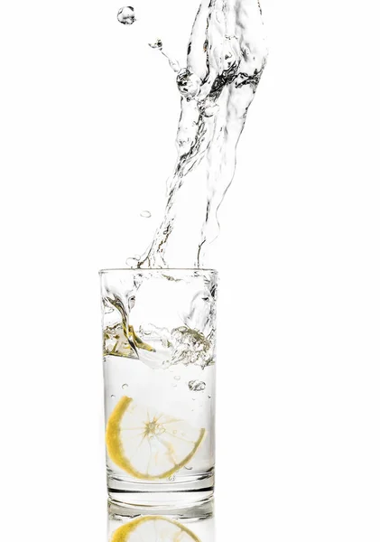 Lemon Splashes Water Glass Isolated White Background — Stock Photo, Image