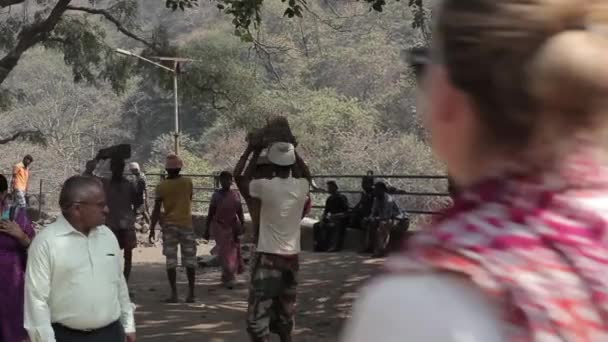 Indian farmers carry the stones on their heads. — Stock Video