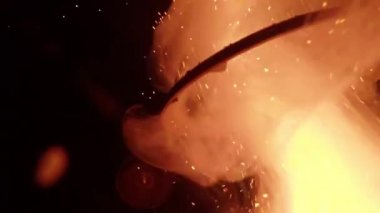 slow-motion footage of burning and explosion of gunpowder as space