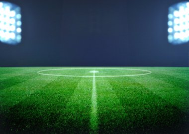 futbol sahası ve parlak ışıklar