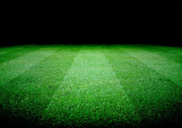 Campo de futebol e as luzes brilhantes — Fotografia de Stock