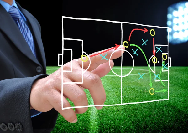 Plan voor voetbal manager op voetbalveld — Stockfoto