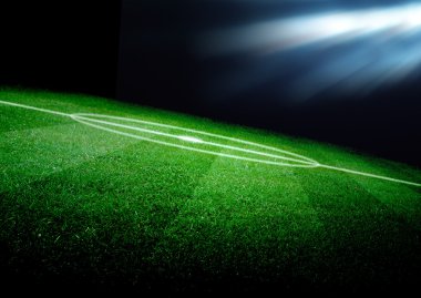 futbol sahası ve parlak ışıklar