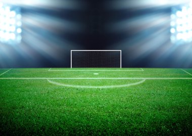 futbol sahası ve parlak ışıklar