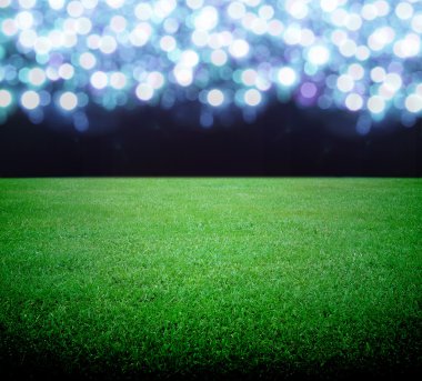 futbol sahası ve parlak ışıklar
