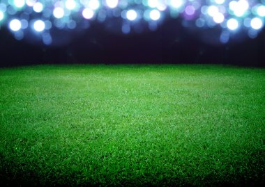 futbol sahası ve parlak ışıklar