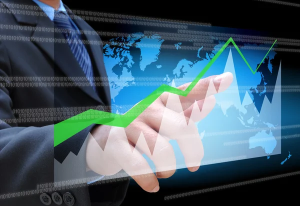 Hand pushing a business graph on a touch screen interface — Stock Photo, Image