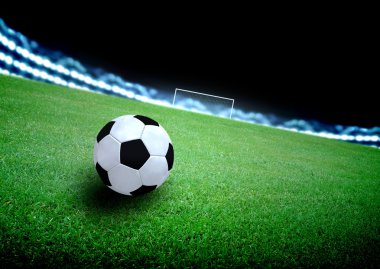 futbol sahası ve parlak ışıklar