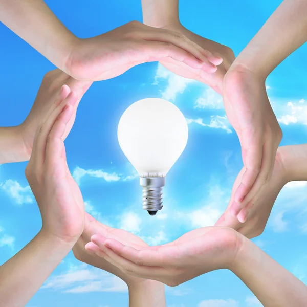 Light bulb in women hand — Stock Photo, Image