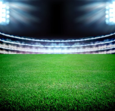 futbol sahası ve parlak ışıklar