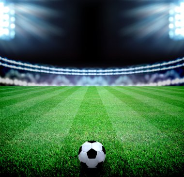 futbol sahası ve parlak ışıklar