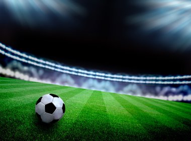 futbol sahası ve parlak ışıklar