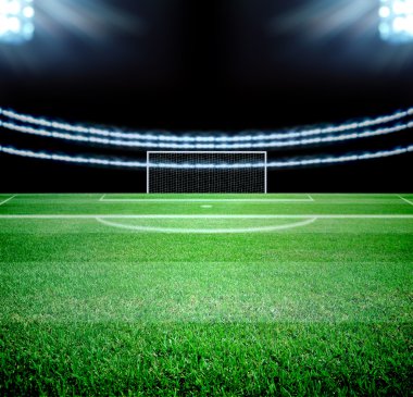 futbol sahası ve parlak ışıklar