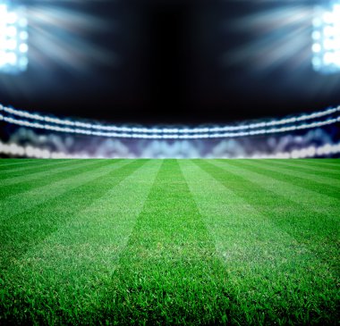 futbol sahası ve parlak ışıklar